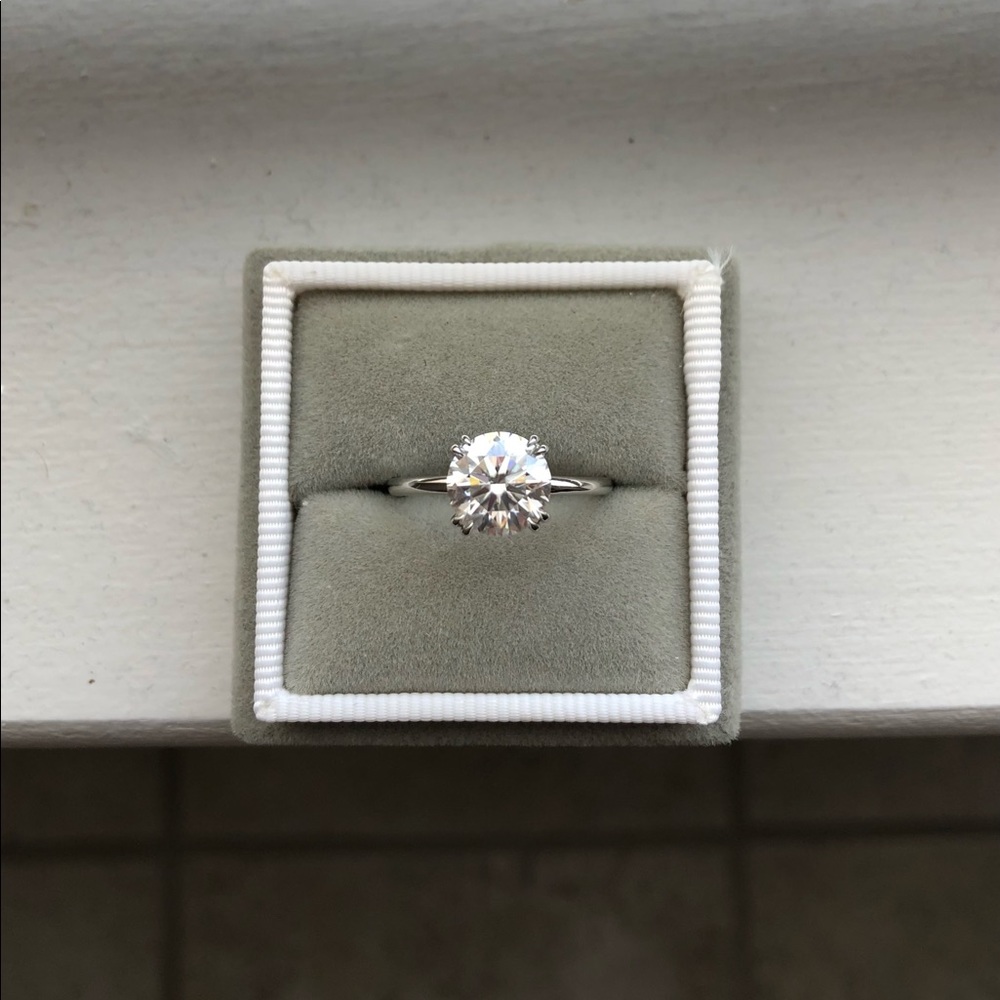 2.0 ct colorless moissanite round solitaire set in platinum